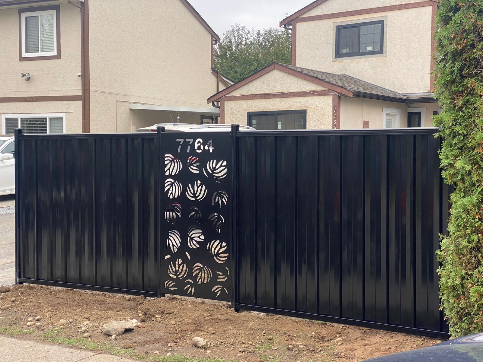Semi-privacy steel fence with balanced spacing — BC